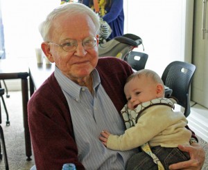 Partner Richard Ogle with Jane Edgerton's grandson, Reeves, at one of the firm's Thanksgiving lunches.